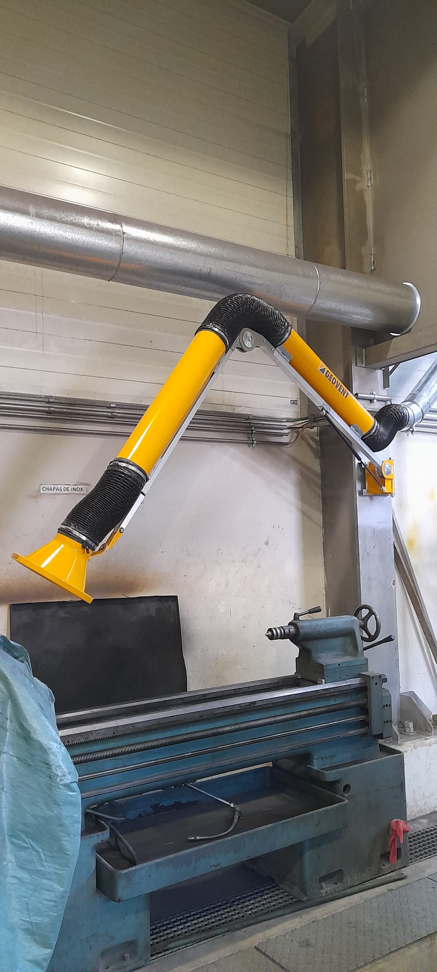 Brazo aspiración en taller